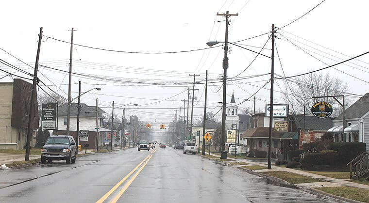 A street-view photograph of Bedford Township in Michigan taken on a rainy day. Bedford, Michigan is a location served by T and J Rooter Service.